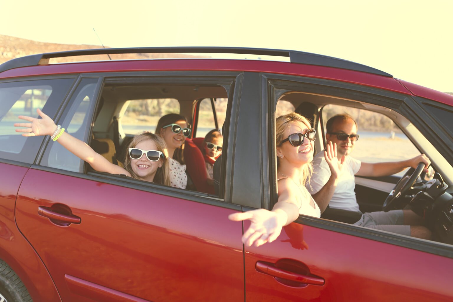 The 5 challenges affecting electric vehicle design and development 3 large family in a red car 1536x1024 1