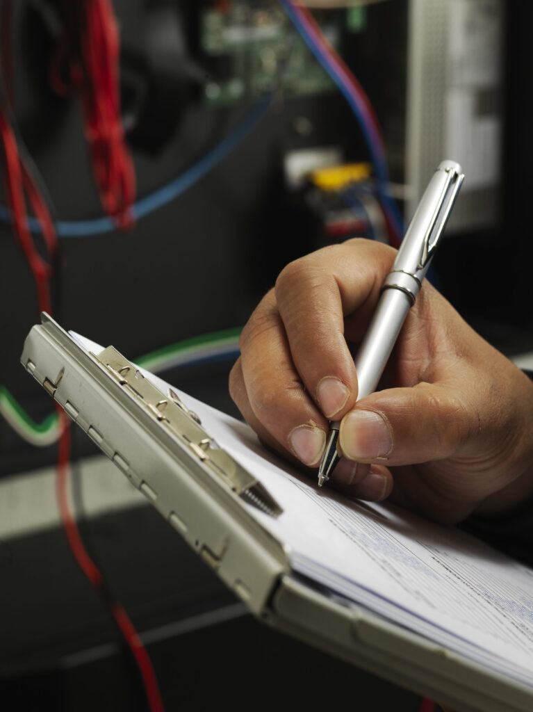 Moving to digital workflows and centralized data through paperless manufacturing 2 Engineer on shop floor uses paper manufacturing documentation