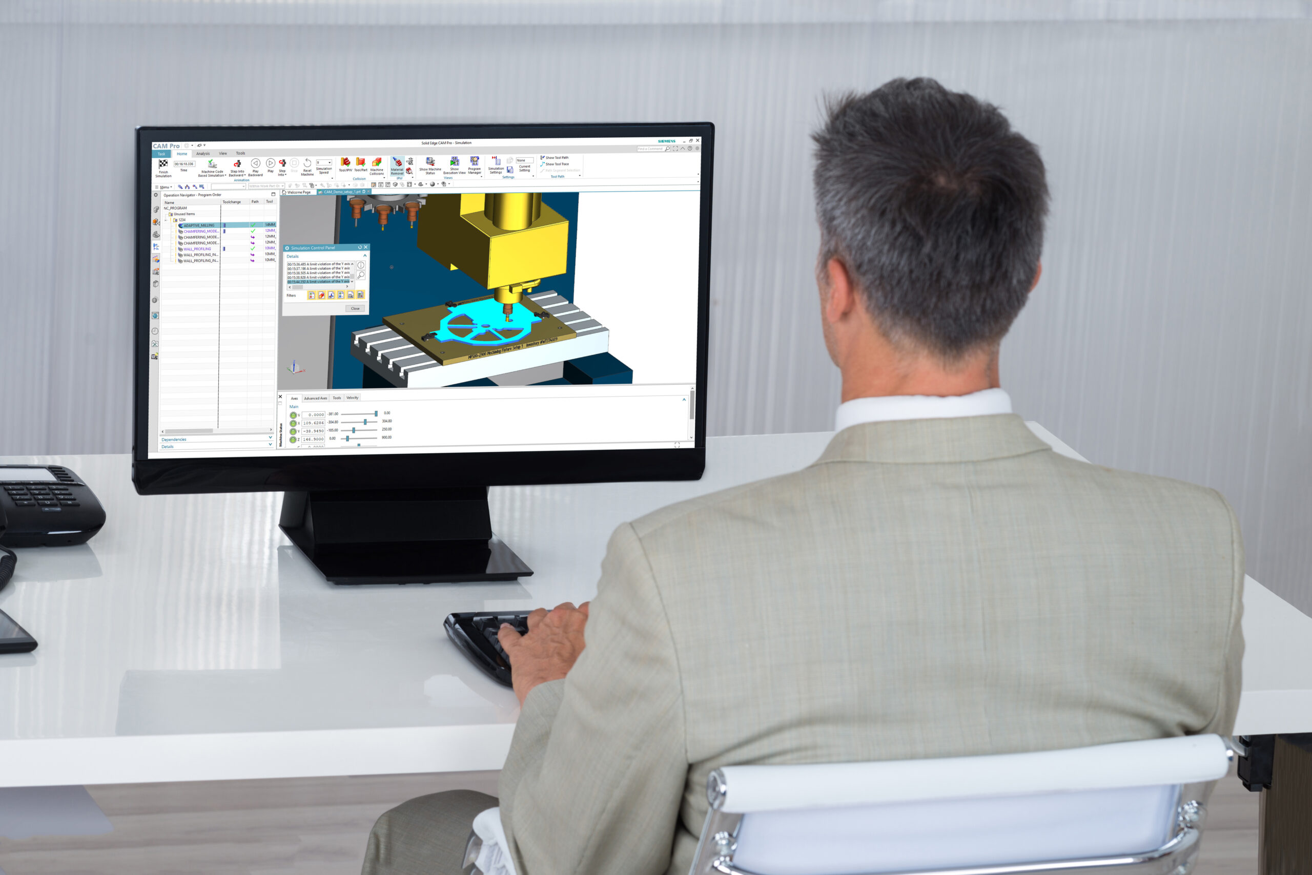 How to get 50% off Solid Edge CAM software 2 Man at computer in a suit working within Solid Edge CAM Pro