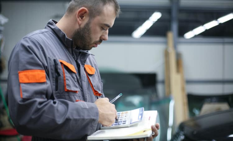 Man operating calculator